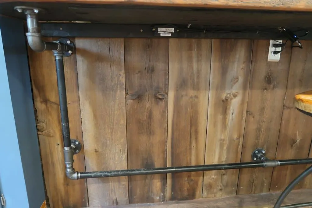 reclaimed wood bar wall industrial piping