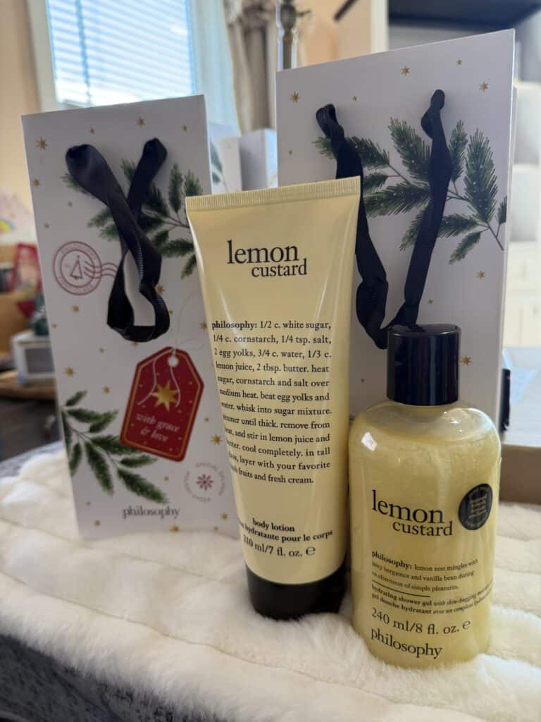 Lemon custard bath and body products featuring natural ingredients and holiday-themed gift packaging.