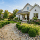 Beautiful low-maintenance front yard with simple landscaping ideas and lush greenery. Perfect for ea.