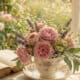 Beautiful teacup floral arrangement with pink roses, lavender, and daisies for charming decor.
