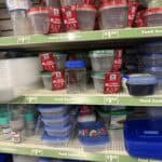 Food storage containers on store shelves for kitchen organization and meal prep.