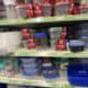 Food storage containers on store shelves for kitchen organization and meal prep.