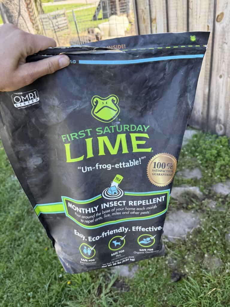 Why I Use First Saturday Lime All Over My Farm (And You Should Too) 1 Organic insect repellent bag with frog logo for garden pest control.