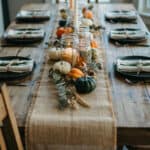 7 Rustic Thanksgiving table with pumpkins and candles for fall decor.