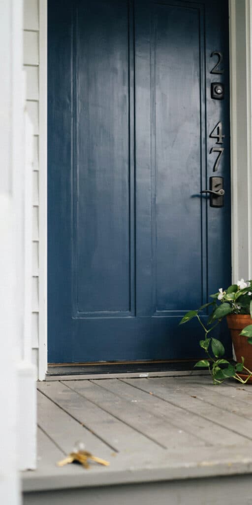 Cheap Front Yard Landscaping Ideas That Look Expensive 10 Blue front door with black hardware and house numbers 247 on the side.