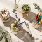 7 Creative mason jar teacher gifts with flowers and supplies.