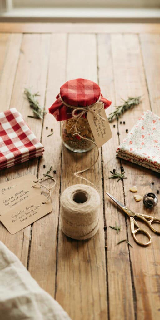 Layered Soup Mix in a Jar: 10 Cozy Recipes to Gift 5 Layered soup mix in a jar with a red checkered lid and gift tag.