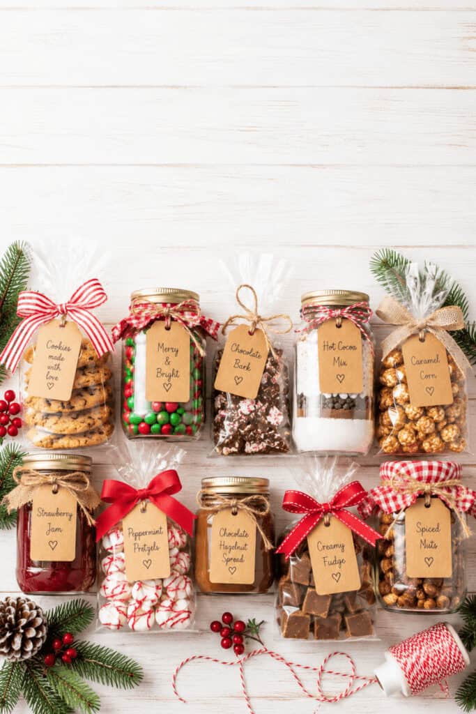 25 Homemade Food Gifts for Christmas That Everyone Loves 2 Assorted homemade food gifts in decorated jars for Christmas.