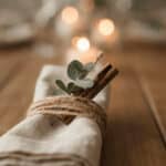7 Rustic napkin ring with twine, cinnamon sticks, and eucalyptus.