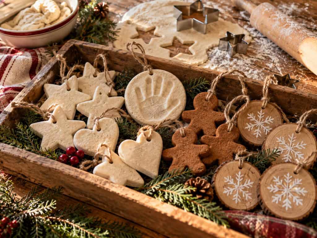 30 Cheap DIY Christmas Decorations That Look Like a Million Bucks 4 Handmade Christmas cookie ornaments with festive designs and natural twine.